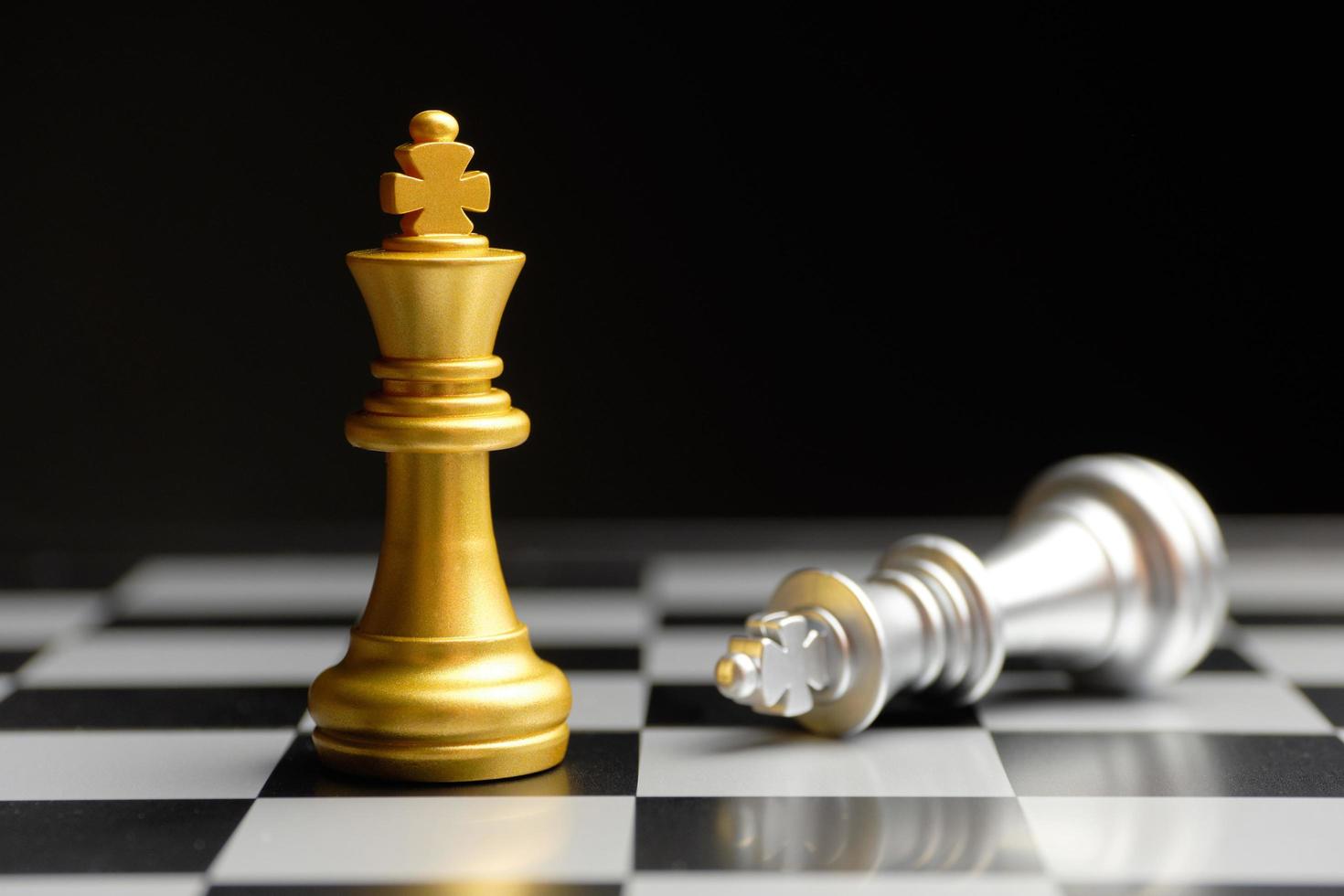 A golden chess king standing victorious over a fallen silver king, symbolizing India’s rise and Western decline in global chess